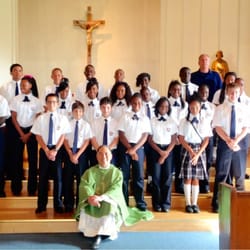 Coach Hill with our Eight Graders and Fr. Jorge