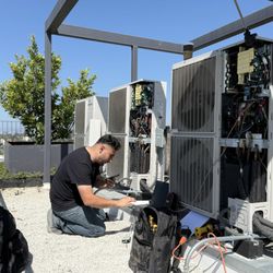 Air Plus HVAC - Arameh on the phone with Samsung tech support to allow them to connect and monitor the system remotely.