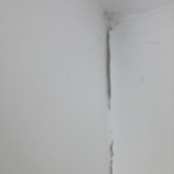 Gerhardt Drywall & Painting - Here's where they had "fixed" cracks in the plaster wall.  24 hours later the "treatment" is peeling off the wall. - Drywall Installation & Repair Near Me