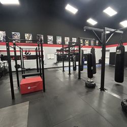 Team Ferreira BJJ - Left: weightlifting & conditioning area Right: MMA/Boxing are Back: BJJ Training Area