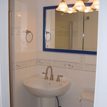 The Jack of All Trades - a bathroom with a sink and toilet - General Contractors Near Me The Jack of All Trades - a bathroom with a sink and toilet - General Contractors Near Me