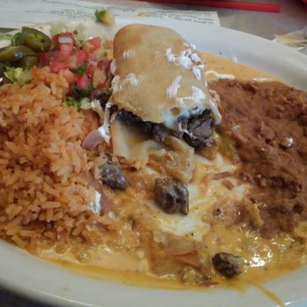 Chuy's - Chuys chimichanga made with fajita steak. - Tex-Mex Near Me - Huntsville, Alabama Chuy's - Chuys chimichanga made with fajita steak. - Tex-Mex Near Me - Huntsville, Alabama