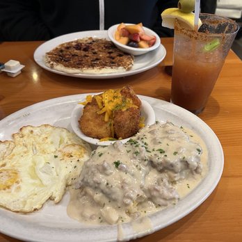 From Scratch Restaurant - Extreme biscuits and gravy, eggs and cheesy fried grits. Blueberry granola pancake on the other side. - Breakfast & Brunch Near Me - Carmel, California