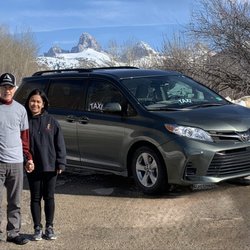 Nathan’s Taxi - Green Toyota Sienna van and my wife MJ