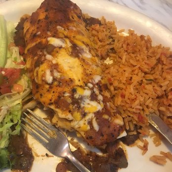 Chuy's - Oven Roasted Chicken Burrito as Big as Your Head with Ranchero Sauce. - Mexican Near Me - Shenandoah, Texas
