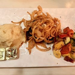 Fortune's Italian Steakhouse - Filet mignon with mashed potatoes vegetables and tobacco onion topper