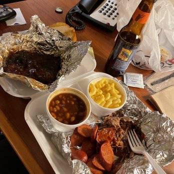 Hog Wild Pit Bar-B-Q - ows a plate of ribs, beans, macaroni and cheese - Barbeque Near Me - Topeka, Kansas