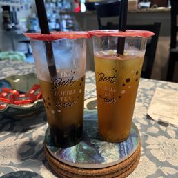 Passion fruit green tea with boba (left), mango mountain tea (right)
