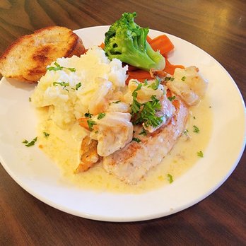 Lemon Leaf Cafe - Salmon topped with shrimp cream sauce served with homemade mashed potatoes and fresh vegetables - Breakfast & Brunch Near Me - Largo, Florida