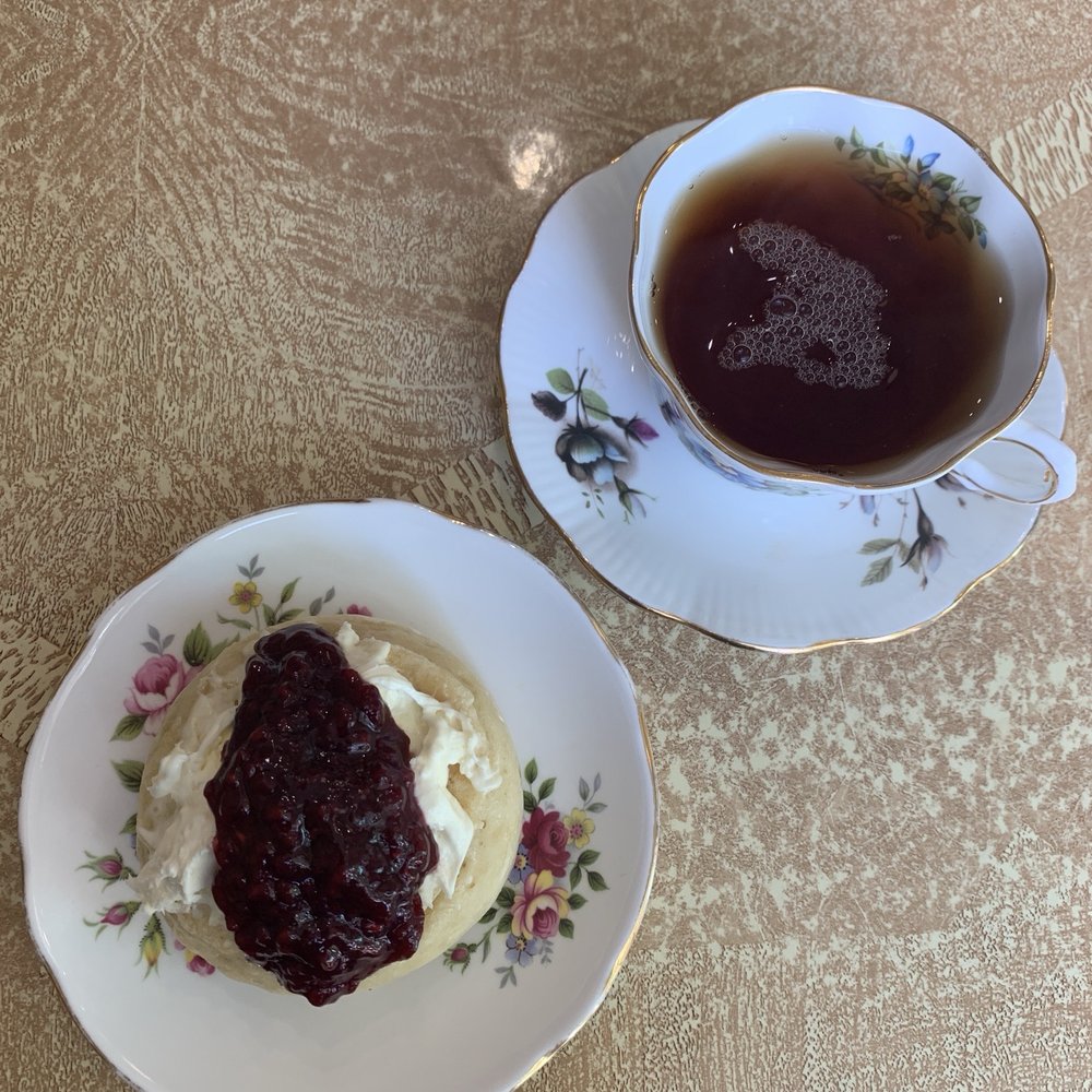 CRUMPETS - Crumpet with clotted cream and raspberry jam along with a cup of Yorkshire gold tea - Cafes Near Me - Rochester, New York
