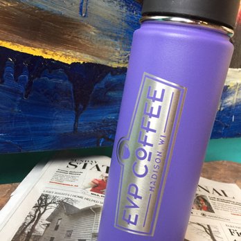 EVP Coffee - a purple water bottle on a table - Coffee & Tea Near Me - Madison, Wisconsin