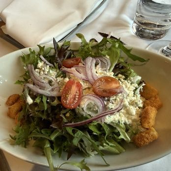 Ruth Chis Steakhouse - Dallas - Starter salad with Bleu cheese crumbles and dressing - Steakhouses Near Me - Dallas, Texas