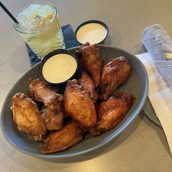 The Goat Pflugerville - Whiskey and Goat Rub seasoned and sauced wings! - Bars Near Me - Pflugerville, Texas