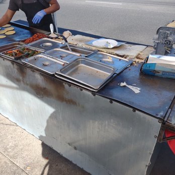 Tacos Ochoa's - a woman preparing food - Mexican Near Me - Los Angeles, California