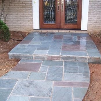 New Era Irrigation - a walkway leading to a front door - Landscaping Near Me New Era Irrigation - a walkway leading to a front door - Landscaping Near Me