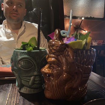 Cellar 335 - *left* smoldering bastard *right* cannibal tropics - Cocktail Bars Near Me - Jersey City, New Jersey