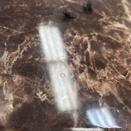 Someone's old eyelashes left on the nail station