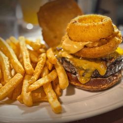 Three Mile House - 3 MILE BURGER -- 8 oz blend of ground chuck, brisket, and short rib on a pretzel bun, topped with bacon, cheddar, swiss, fried cheese curds