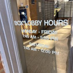 U.S. Postal Service - Box lobby hours posted on front door of Post Office