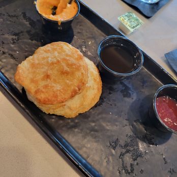 The Goat Pflugerville - Biscuit board- 3 biscuits with spicy pimento, hot honey, and strawberry preserves - Bars Near Me - Pflugerville, Texas The Goat Pflugerville - Biscuit board- 3 biscuits with spicy pimento, hot honey, and strawberry preserves - Bars Near Me - Pflugerville, Texas