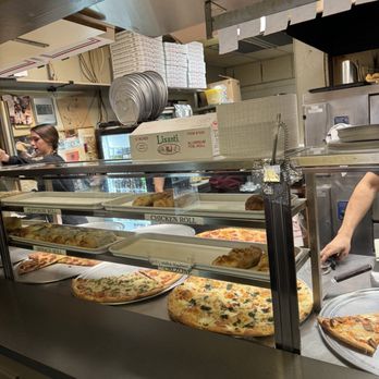 La Scala - a man preparing pizzas in a kitchen - Italian Near Me - Westlake, Texas