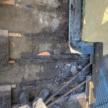 Hernandez's Roofing - Tiles removed and flashing cleared out of debris to replace tar paper. - Roofing Near Me
