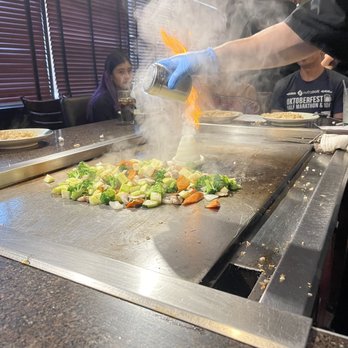 Hayashi Hibachi - a person cooking vegetables on a grill - Japanese Near Me - McAllen, Texas Hayashi Hibachi - a person cooking vegetables on a grill - Japanese Near Me - McAllen, Texas