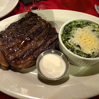 The Peddler Steak House - 12oz Rib Eye with Creamed Spinach - Steakhouses Near Me - Greenville, South Carolina The Peddler Steak House - 12oz Rib Eye with Creamed Spinach - Steakhouses Near Me - Greenville, South Carolina