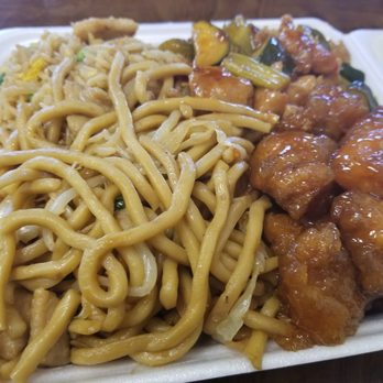 Asian Express - #5 half chow mein, half fried rice, with orange chicken and kungpao chicken. $7.55 plus tax - Chinese Near Me - Pittsburg, California