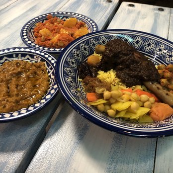 Moroccan Flavors - Lamb shank tagine, grilled eggplant, side of carrot w raisins/rosewater - Moroccan Near Me - Minneapolis, Minnesota Moroccan Flavors - Lamb shank tagine, grilled eggplant, side of carrot w raisins/rosewater - Moroccan Near Me - Minneapolis, Minnesota
