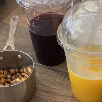 Somos Tu Peru - Fried corn table nibbles.The Purple corn drink tis made from purple corn. The yellow one is a frozen Passion Fruit drink! - Peruvian Near Me - Paterson, New Jersey