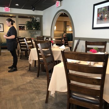 Great Wall Chinese Restaurant - a woman standing in the dining room - Chinese Near Me - Rapid City, South Dakota