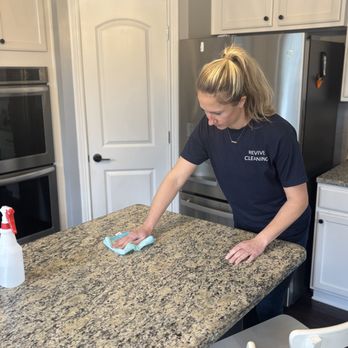 Revive Cleaning - Cleaning granite countertop with stone-safe cleaner - Home Cleaning Near Me Revive Cleaning - Cleaning granite countertop with stone-safe cleaner - Home Cleaning Near Me
