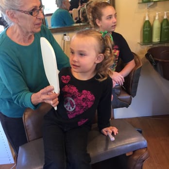 Rocky's Custom Hair - Kylie looking at her hair. - Hair Salons Near Me - Ocean Shores, Washington Rocky's Custom Hair - Kylie looking at her hair. - Hair Salons Near Me - Ocean Shores, Washington