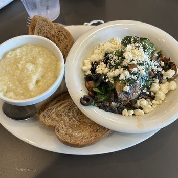 Eggs Up Grill - Greek Scrambler - delicious, with 2 pieces of rye and grits. - Breakfast & Brunch Near Me - Mechanicsville, Virginia Eggs Up Grill - Greek Scrambler - delicious, with 2 pieces of rye and grits. - Breakfast & Brunch Near Me - Mechanicsville, Virginia