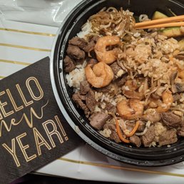 Shrimp and steak hibachi bowl, vegetables are mushroom onion zucchini bean sprouts.