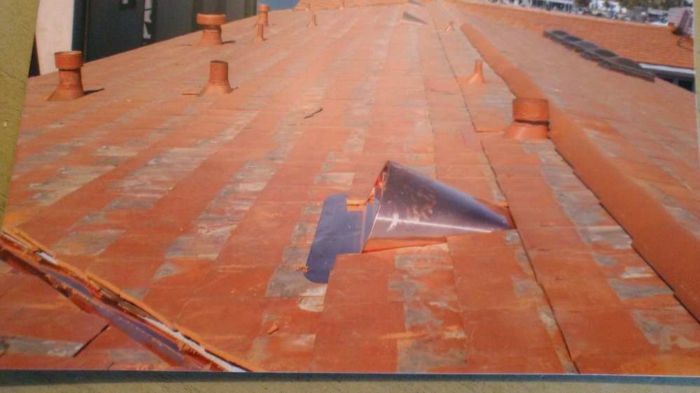 Slide of Magic Hands Roofing
