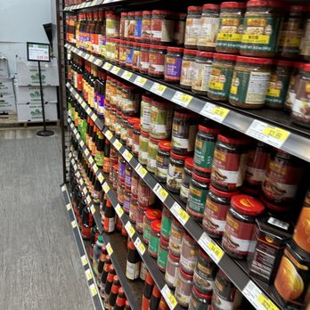 H Mart - Schaumburg - a grocery store aisle filled with jars of condiments - Grocery Near Me - Schaumburg, Illinois