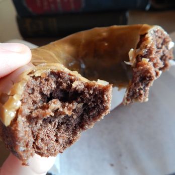Top Pot Doughnuts - Partway through the maple frosted chocolate cake donut. - Bakeries Near Me - Edmonds, Washington