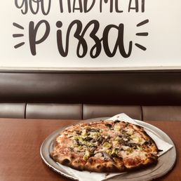Thin and crispy vegetable pizza with anchovies.