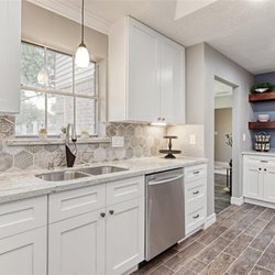 Clear Sky Developments - Kitchen remodel with soft close cabinets, quartz counters, elegant backsplash and touch faucet.