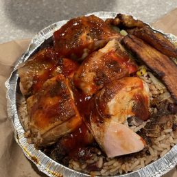 Jerk chicken with chicken gravy over the peas and rice and veg.