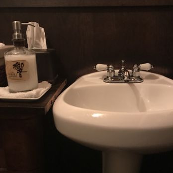Canon - A hibiki bottle used to hold the soap - New American Near Me - Seattle, Washington
