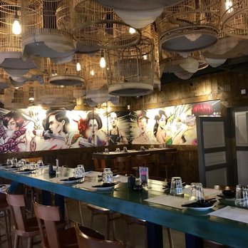YUU Kitchen - From the front: Interior table seating and decor. - Chicken Wings Near Me - London, XGL YUU Kitchen - From the front: Interior table seating and decor. - Chicken Wings Near Me - London, XGL