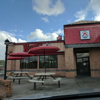 Wendy's - the outside of a restaurant with tables and umbrellas - Burgers Near Me - Bristol, Virginia Wendy's - the outside of a restaurant with tables and umbrellas - Burgers Near Me - Bristol, Virginia