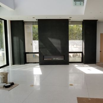 Sami's Classic - an empty living room with a fireplace - General Contractors Near Me - Sherman Oaks, California