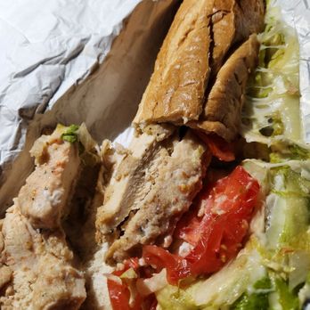 Leo's Pizza - a chicken sandwich with lettuce and tomatoes - Pizza Near Me - Narragansett, Rhode Island