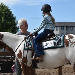 Silver Springs Equestrian Center - Barn owner Steve Skiba with his granddaughter at the Olmsted County Fair