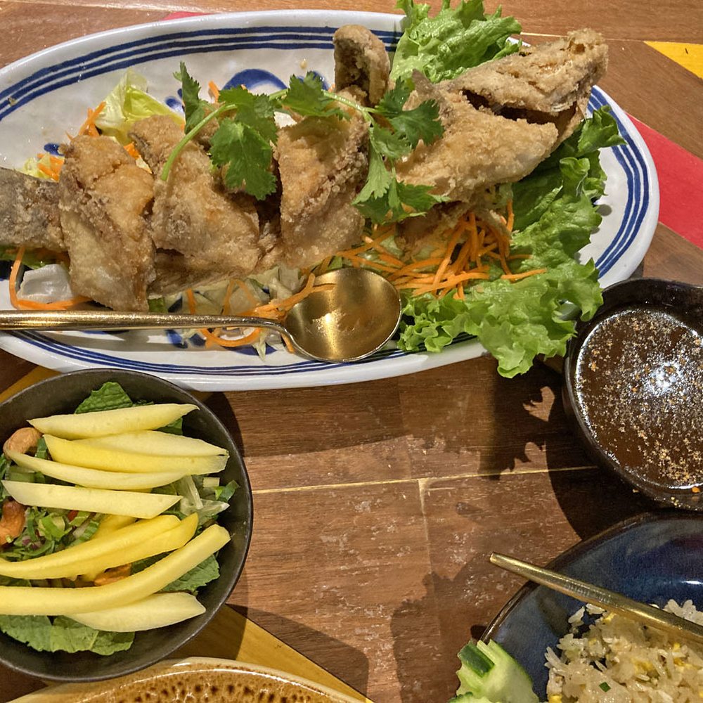 Pii Nong - Pla Lui Suan (fried whole branzino fish with fresh Thai herbs & mango salad in a tangy & sweet tamarind dressing) - Thai Near Me - Toronto, Ontario Pii Nong - Pla Lui Suan (fried whole branzino fish with fresh Thai herbs & mango salad in a tangy & sweet tamarind dressing) - Thai Near Me - Toronto, Ontario