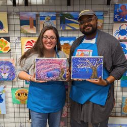 Art Mixer - Couple posing with their finished paintings